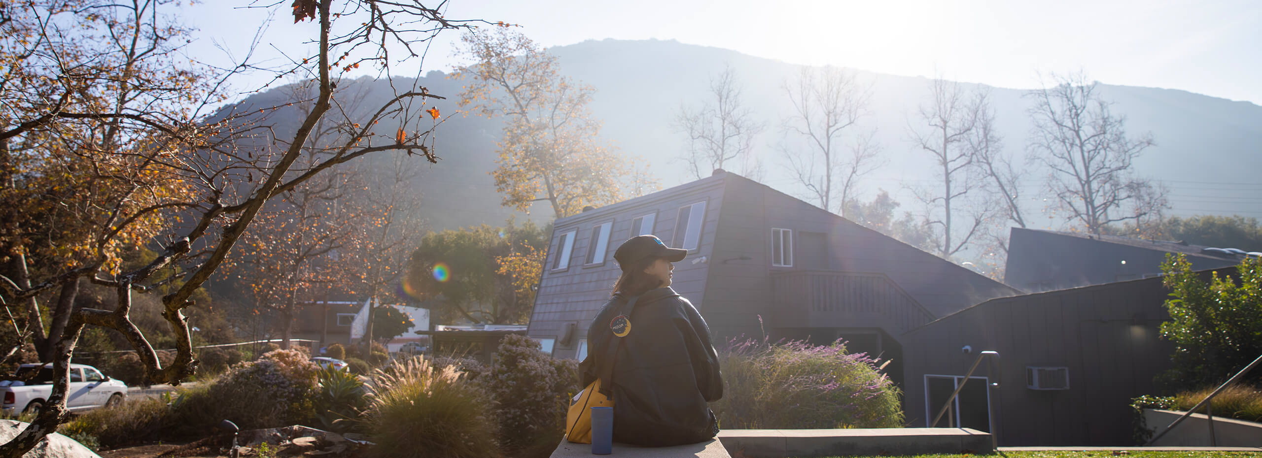 A photo of a student sitting in Nina's Park.