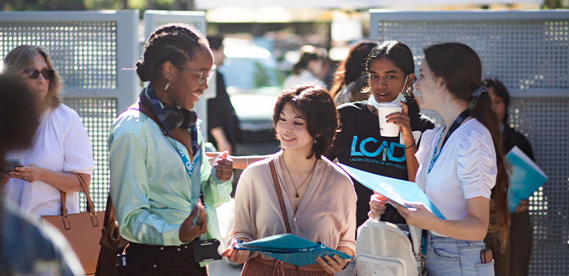 Undergraduate Art college students. A photo of students hanging out in the Big Bend courtyard.