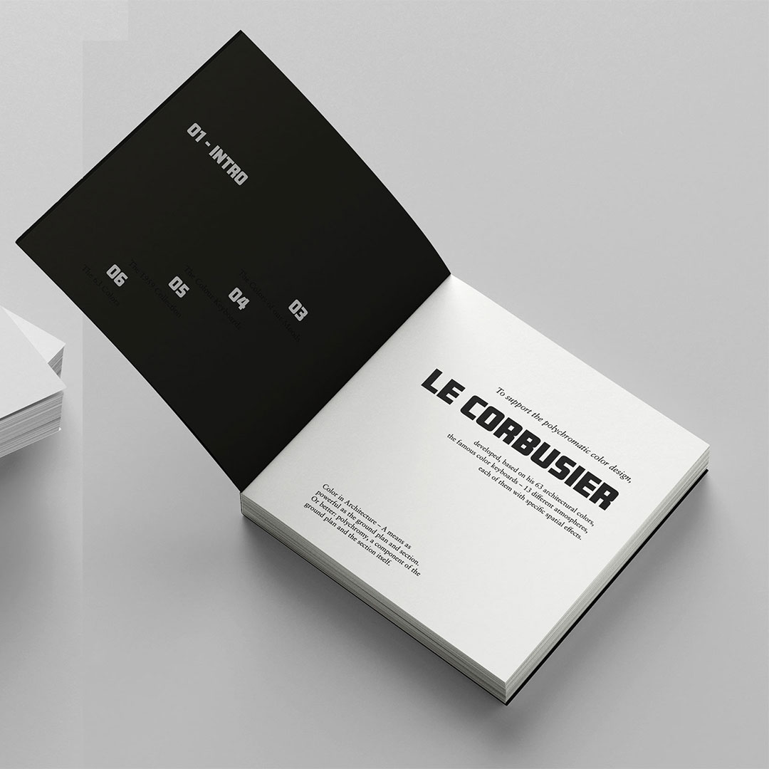 A photo of three white books, with a black block font on them.