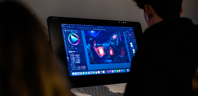 A photo of a student working at a computer.