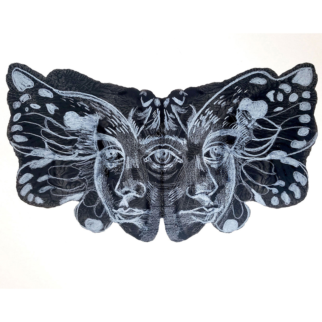 A drawing of a face in a butterfly's wings.