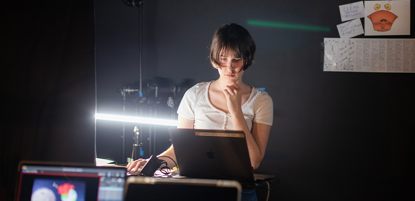 A photo of a student at a light table.