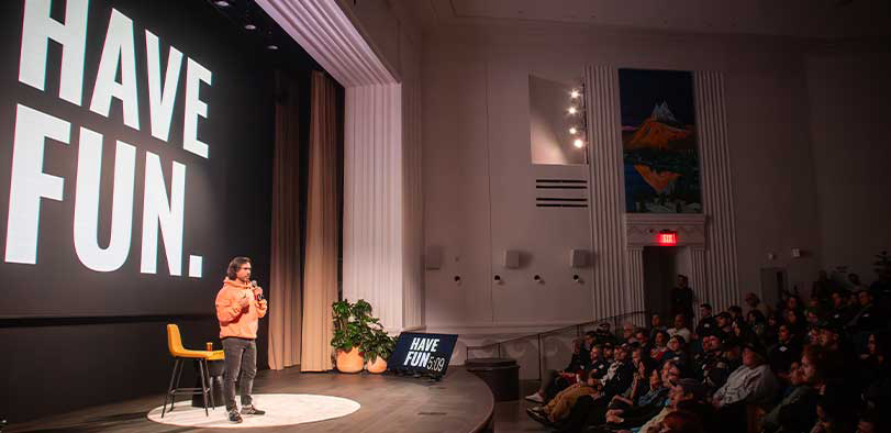 A photo of Andy Pearson on stage giving a talk.