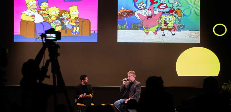 A photo of Povenmire giving a talk on the Rivian stage.