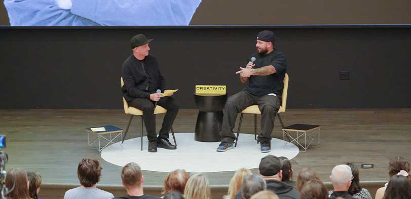 A photo of Vides giving a talk on the Rivian stage.