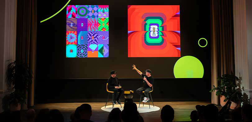 A photo of Morley giving a talk on the Rivian stage.