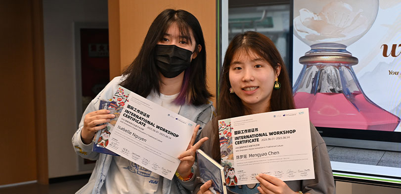 A photo of students posing with certificates.