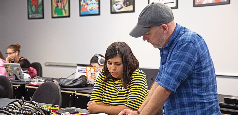 A photo of an instructor and a student.