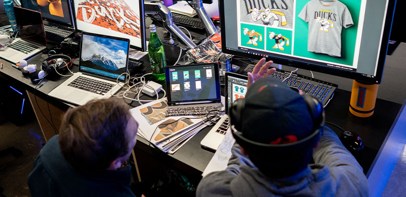 A photo of two students working at computers.