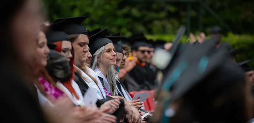 Laguna College of Art + Design graduates in caps and gowns at commencement