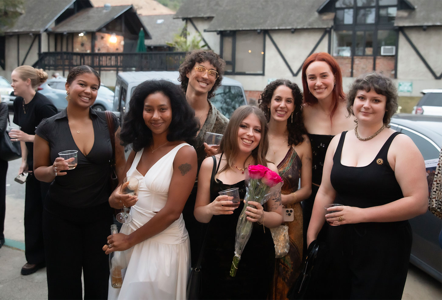 A photo of people at the BFA graduate exhibition in the LCAD Gallery.